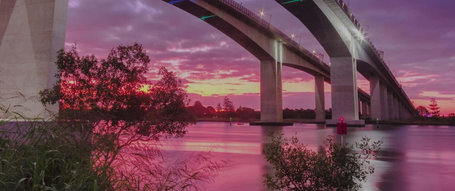 Image of a Bridge over a River at Sunset