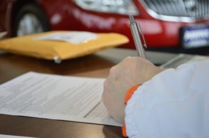 images of someone signing contract