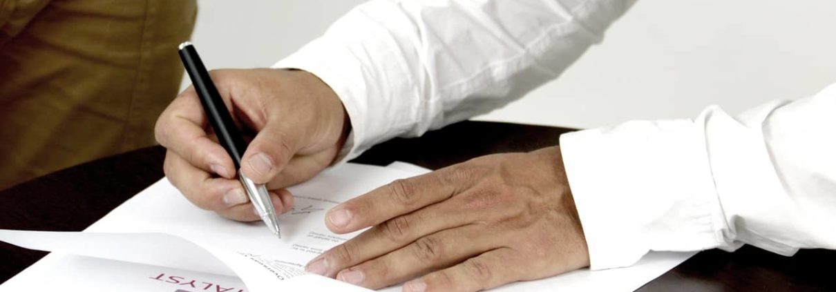 image of someone signing Asset Finance contact, Free up Funds