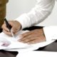 image of someone signing Asset Finance contact, Free up Funds
