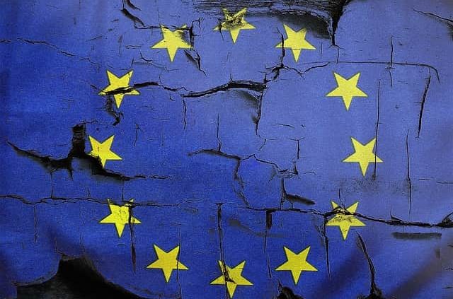 image showing crumbling EU flag, Brexit impacted the UK economy