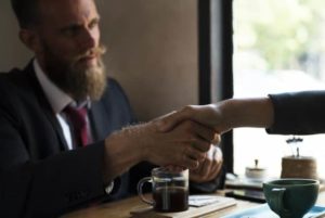 image of man shaking hand in business deal