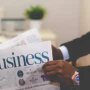 picture of a businessman reading a newspaper, Pick a Loan Broker